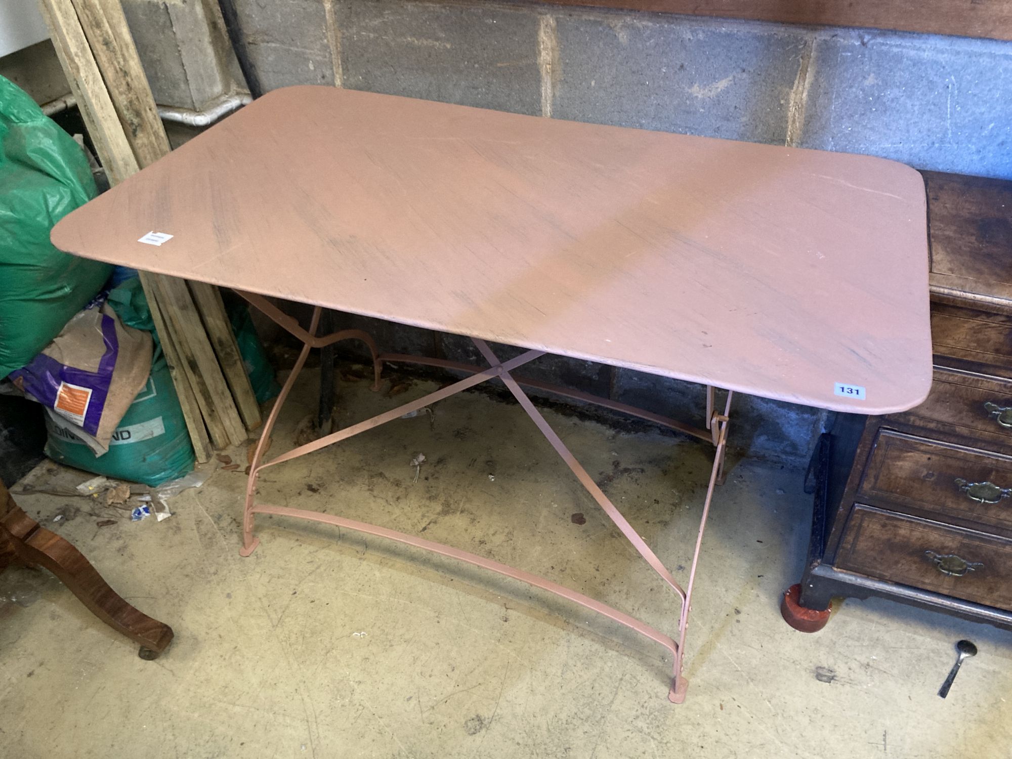 A painted metal folding garden table, width 124cm, depth 72cm, height 74cm